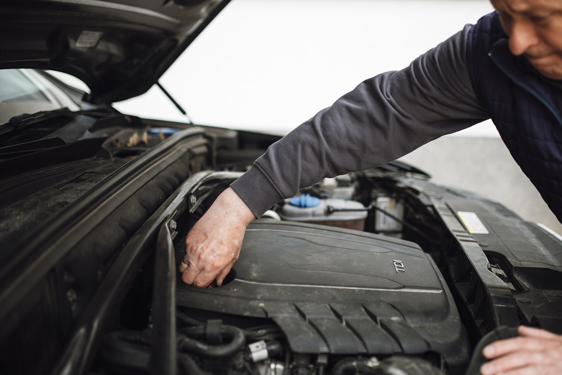A technician inspecting a vehicle before purchase